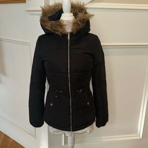 Small black coat with a four piece that can be buttoned on or buttoned off